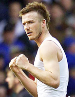 Manchester United's David Beckham celebrates his team victory over Leeds United during their English premier league match at Elland Road in Leeds on Saturday. 