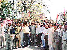 DYC activists take out a protest march demanding imposition of President�s rule in J and K in Ludhiana on Monday.