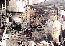 Policemen inspect the site of a blast in a foundry, in Ludhiana on Wednesday. 
