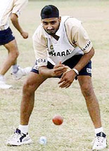 Harbhajan Singh does catching exercises during practice in Georgetown, Guyana, on Tuesday.