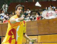 Pulella Gopichand returns against Lai Kuan Hung of Taiwan during the men�s singles first round match at the Yonex Japan Open Badminton Championships in Tokyo on Wednesday.
