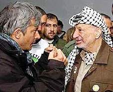 Palestinian leader Yasser Arafat listens to an unidentified representative of the International Protection Movement 