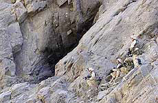 Soldiers attack a cave