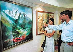 Bheem Malhotra points to "Valley of my dreams through the mirror", one of his many landscapes