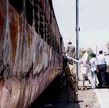 Prime Minister Atal Behari Vajpayee enters the charred bogie