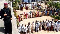 A commando stands on the rooftop