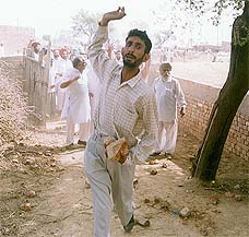 An unidentified activist charges at an opponent