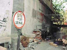 This signboard was put up here about a year ago, but no urinal has been built so far.