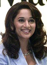 Bollywood actress Madhuri Dixit smiles during the launch of cosmetic products