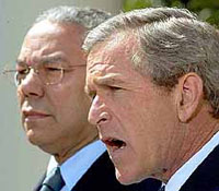 President Bush makes a statement about West Asia as Secretary of State Colin Powell looks on