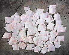 Torn electricity bills, which were found under a culvert at a deserted area in Kalka on Sunday.