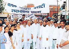 The Congress president, Mr B.B. Bahl (centre), leading "sadbhavna rally" of the party at Mani Majra in Chandigarh on Sunday.