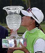 Se Ri Pak of South Korea kisses the trophy after winning the LPGA Office