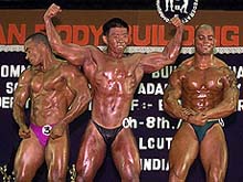 Tong Chin Wee (C) of Singapore, the winner of heavy weight category