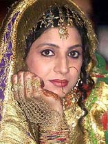 A model dressed up in traditional bridal wear