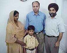 Neelam Rani and her son, Arun Kumar, with two doctors at Jalandhar�s BBC Heart Care Centre.