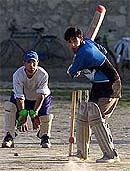 Members of the Kabul cricket team practice in the centre of the capital of Afghanistan