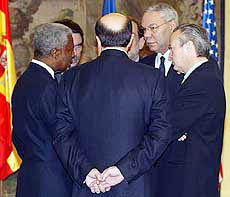 UN Secretary General Kofi Annan (L), Spanish Prime Minister Jose Maria Aznar (2nd L), Russian Foreign Minister Igor Ivanov (C), EU Foreign Policy Chief Javier Solana (behind Ivanov), US Secretary of State Colin Powell (2nd R) and Spanish Foreign Minister Josep Pique gather around prior to a meeting to discuss the situation in West Asia, in Madrid on Wednesday.