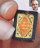 A rare lithoprint that was shown to reporters in Panchkula on Thursday; and (inset) owner of the book, Mr Ravi Bhasin.