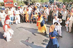 Devotees perform �gatka� at a nagar kirtan organised for Baisakhi in Chandigarh on Thursday.