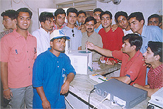 Youth of the city throng a Super Lotto cafe