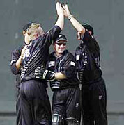 The New Zealand team celebrate the fall of Pakistan opener