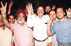 Mr N.K. Nanda (centre) in a jubilant mood after being elected the president of the District Bar Association for the third time, in Chandigarh on Friday. 