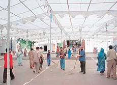 Employees of the Sri Mata Mansa Devi Shrine Board give final touches to the outer precincts of the Mansa Devi temple 