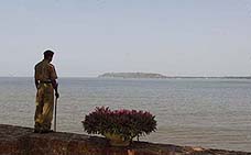 A security personnel keeps vigil