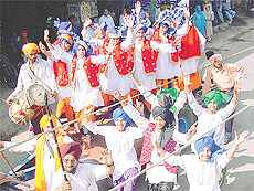 A Bhangra team leads a Baisakhi nagar kirtan on Friday in Ludhiana