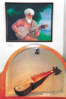 A rabab placed below the portrait of Baba Mardana          Photos by Manoj Mahajan