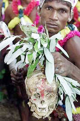 A devotee from the Tantric sect holds a human skull 