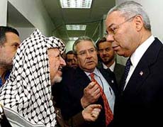 Palestinian leader Yasser Arafat talks to US Secretary of State Colin Powell before their meeting at Arafat�s besieged office in Ramallah on Sunday.