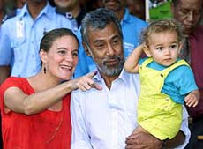 Presidential hopeful Xanana Gusmao holds his son