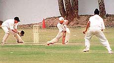 Asifuddin of Boys Town, Hyderabad, plays a shot in the opening match of the Parle Champions Trophy Cricket tournament in Chandigarh on Monday.
