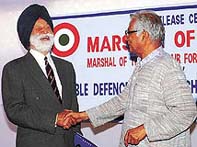 Defence Minister George Fernandes congratulates Marshal of the Indian Air Force Arjan Singh