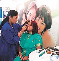 A city woman gets her make-up done from a beautician in Ludhiana.