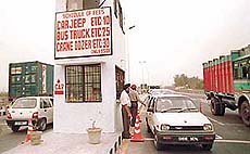 Commuters being charged toll tax at barriers on the recently opened railway overbridge on the Chandigarh-Ambala highway that has caused confusion among road users over the validity of toll tax receipts.