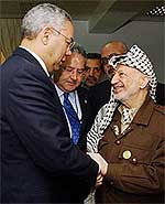 Palestinian President Yasser Arafat greets US Secretary of State Colin Powell 