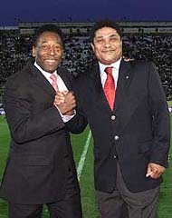 Soccer legends Pele, left, from Brazil, and Eusebio, from Portugal, share a smile 