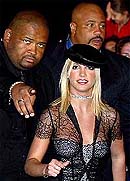U.S. entertainer Britney Spears is guided by her bodyguards