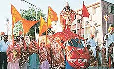 A large procession being taken out by devotees 