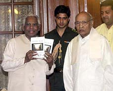 President K. R. Narayanan receives the book