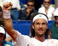 Carlos Moya of Spain celebrates 