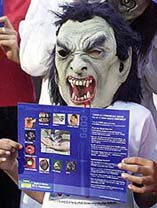 A child wears a mask symbolising death