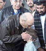 Former Afghan King Mohammad Zaher Shah kisses seven-year-old Ahmed