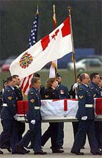 Honour guards carry the coffin containing the remains of a killed Canadian soldier