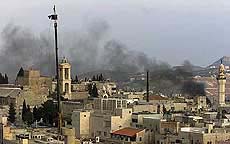 Smoke billows over the Church of Nativity