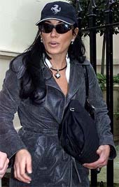 Italian lawyer Nancy Dell 'Olio leaves the central London house she shares with England's Swedish football manager Sven Goran Eriksson