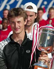 Juan Carlos Ferrero of Spain raises the victory cup